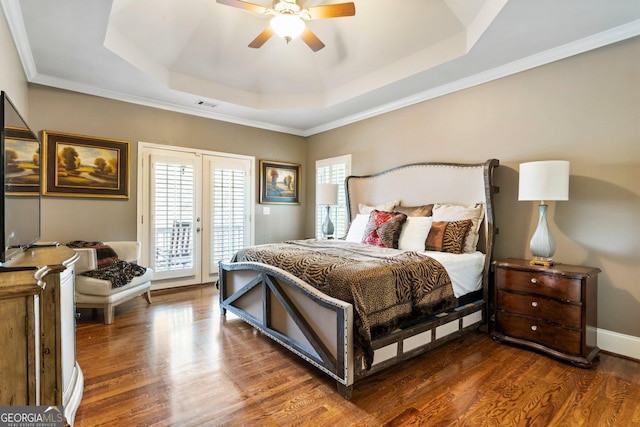 150 Inwood Ter, Roswell, GA 30075 - bedroom with visible vents, a raised ceiling, a ceiling fan, wood finished floors, and access to outside