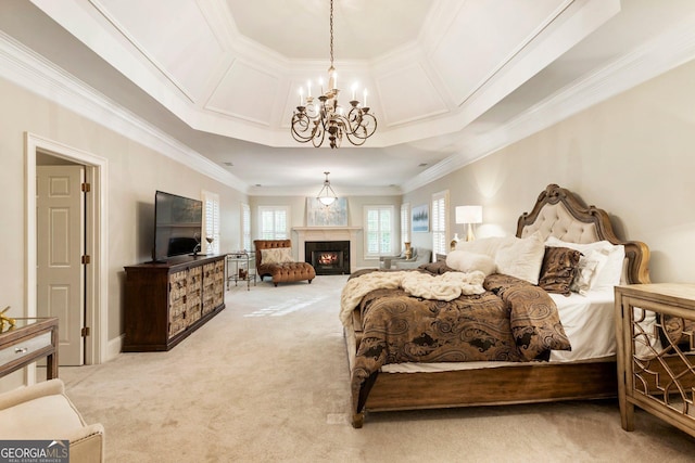 150 Inwood Ter, Roswell, GA 30075 - bedroom featuring light colored carpet, an inviting chandelier, ornamental molding, and a warm lit fireplace
