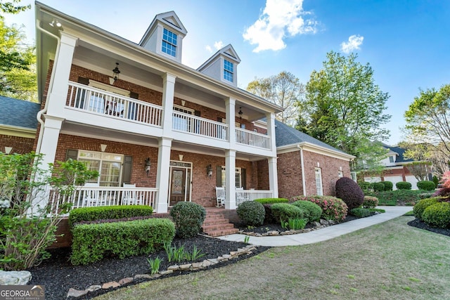 150 Inwood Ter, Roswell, GA 30075 - greek revival inspired property featuring brick siding, ceiling fan, covered porch, and a balcony