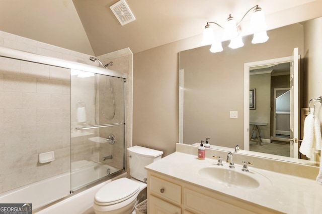 150 Inwood Ter, Roswell, GA 30075 - bathroom featuring visible vents, combined bath / shower with glass door, toilet, vanity, and vaulted ceiling
