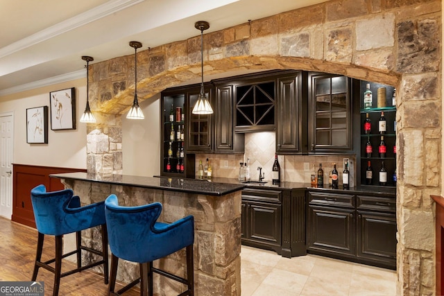150 Inwood Ter, Roswell, GA 30075 - bar featuring a sink, ornamental molding, wet bar, wainscoting, and backsplash