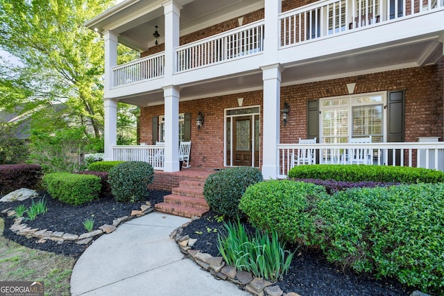 150 Inwood Ter, Roswell, GA 30075 - property entrance featuring brick siding, a balcony, and covered porch