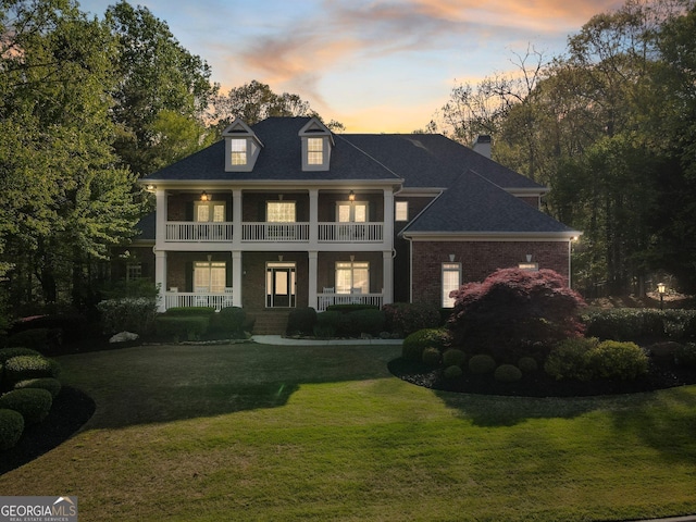 150 Inwood Ter, Roswell, GA 30075 - greek revival house with a front yard, a porch, a balcony, and a chimney