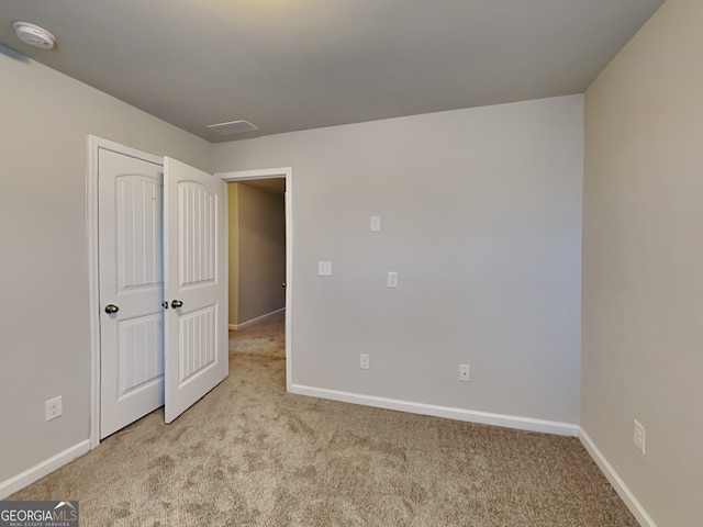 3713 Upland Dr, Mcdonough, GA 30253 - unfurnished bedroom with baseboards and carpet floors