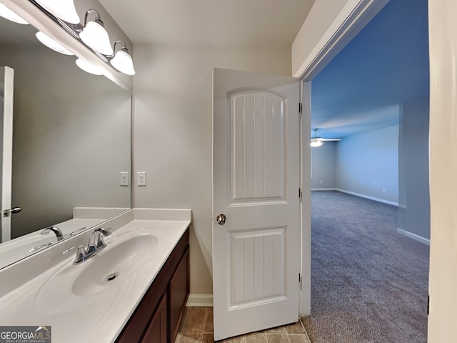 3713 Upland Dr, Mcdonough, GA 30253 - bathroom with baseboards, a ceiling fan, and vanity