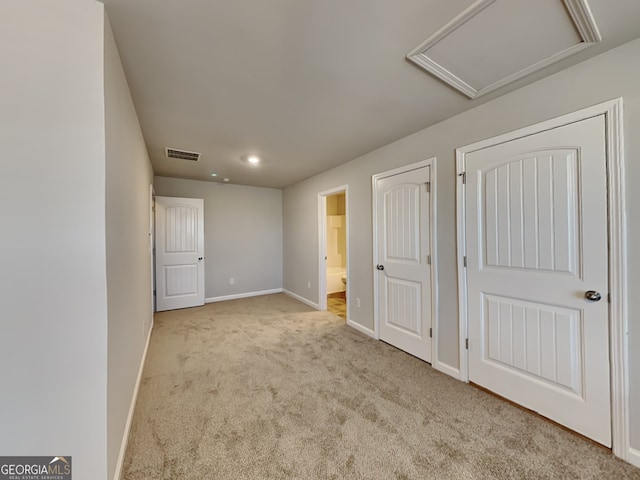 3713 Upland Dr, Mcdonough, GA 30253 - unfurnished bedroom featuring visible vents, carpet, baseboards, attic access, and ensuite bath