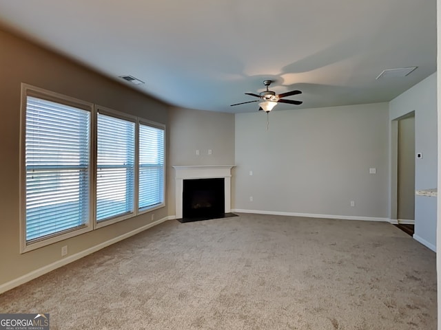 3713 Upland Dr, Mcdonough, GA 30253 - unfurnished living room featuring carpet, a fireplace with flush hearth, baseboards, and visible vents