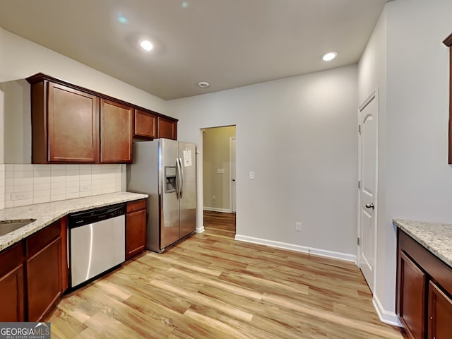 3713 Upland Dr, Mcdonough, GA 30253 - kitchen with decorative backsplash, stainless steel appliances, light wood-type flooring, and light stone counters