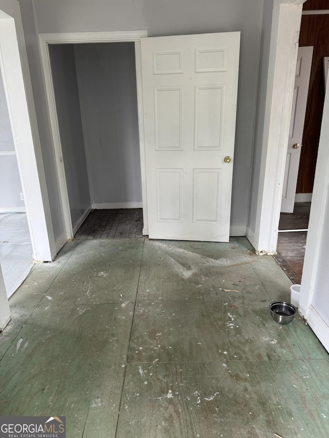 unfurnished bedroom featuring baseboards
