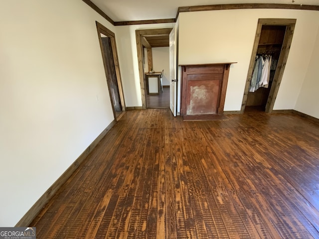 2790 Old Farmington Rd, Watkinsville, GA 30677 - unfurnished living room featuring dark wood-style floors and ornamental molding