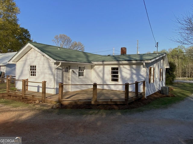 2790 Old Farmington Rd, Watkinsville, GA 30677 - back of property with a deck, a metal roof, and a chimney