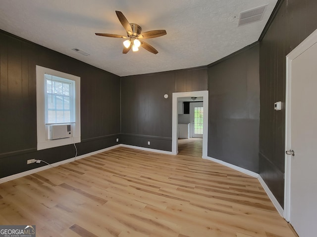 508 Granite St, Hogansville, GA 30230 - empty room featuring cooling unit, ceiling fan, visible vents, and light wood-type flooring