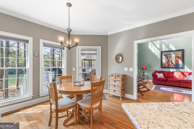 404 Golden Delicious Rd, Clarkesville, GA 30523 - dining space featuring ornamental molding, baseboards, a notable chandelier, and visible vents