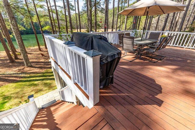 404 Golden Delicious Rd, Clarkesville, GA 30523 - wooden deck with a water view and outdoor dining space