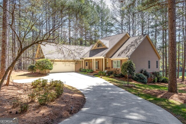 404 Golden Delicious Rd, Clarkesville, GA 30523 - view of front of property featuring an attached garage, roof with shingles, and concrete driveway