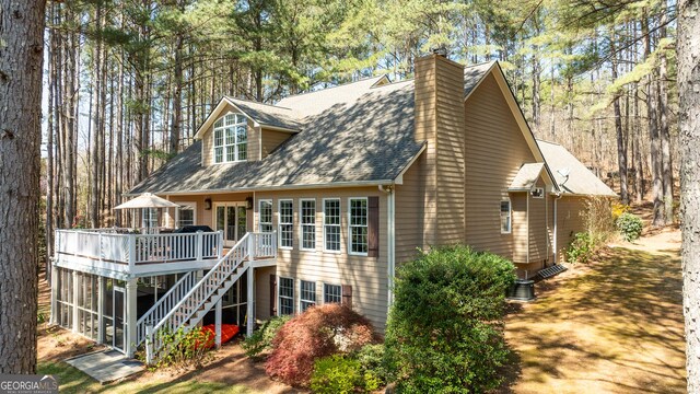 404 Golden Delicious Rd, Clarkesville, GA 30523 - back of house featuring a chimney, central air condition unit, a shingled roof, a wooden deck, and stairs
