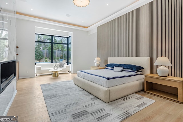 bedroom with recessed lighting, wood finished floors, and ornamental molding