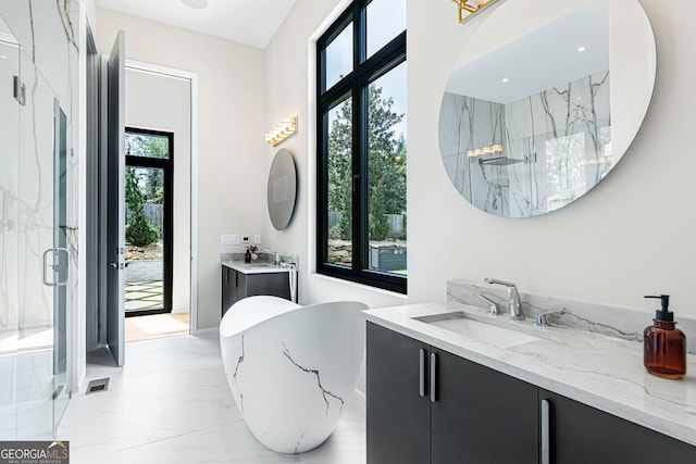 full bath with a soaking tub, a marble finish shower, a sink, and marble finish floor