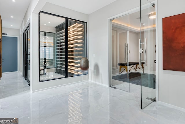 interior space with visible vents, baseboards, marble finish floor, and recessed lighting