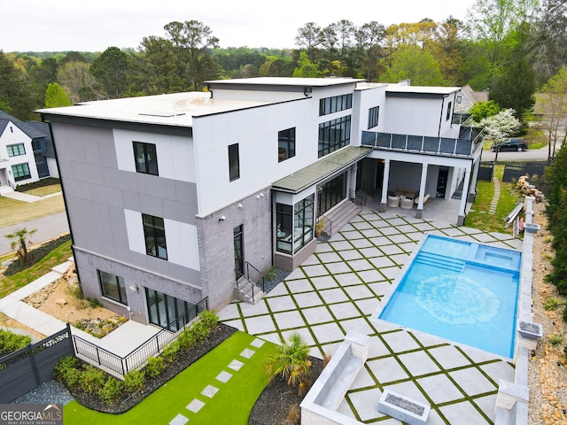 view of swimming pool with a fenced backyard, a fenced in pool, and a patio