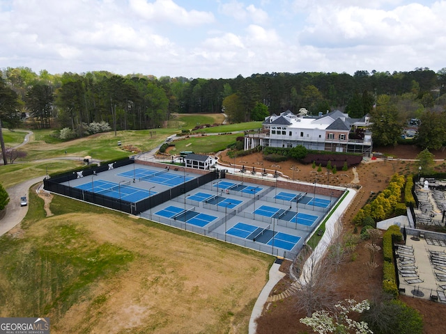 birds eye view of property with a wooded view