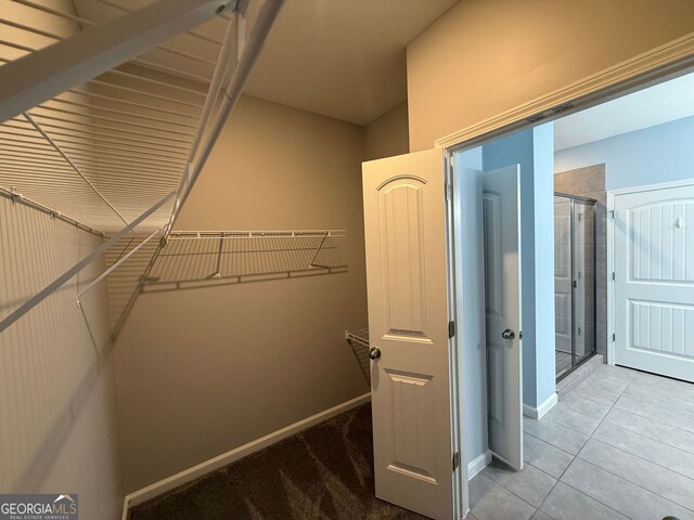 2460 Laurel Gate Ln, Cumming, GA 30040 - walk in closet with tile patterned flooring