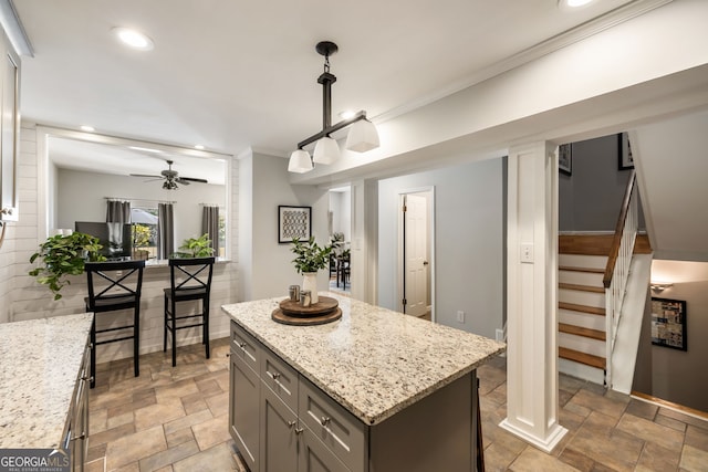 3772 Paces Ferry W SE, Atlanta, GA 30339 - kitchen featuring stone finish floors, gray cabinets, a center island, recessed lighting, and light stone countertops