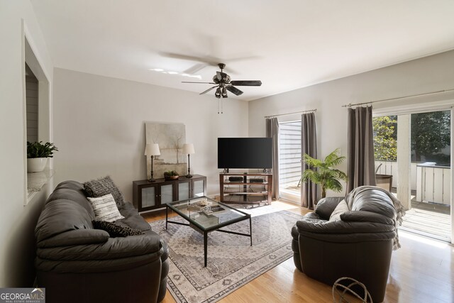 3772 Paces Ferry W SE, Atlanta, GA 30339 - living area featuring light wood-style floors and a ceiling fan