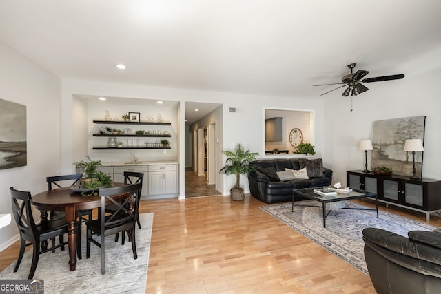 3772 Paces Ferry W SE, Atlanta, GA 30339 - living area featuring a bar, light wood-type flooring, a ceiling fan, baseboards, and recessed lighting