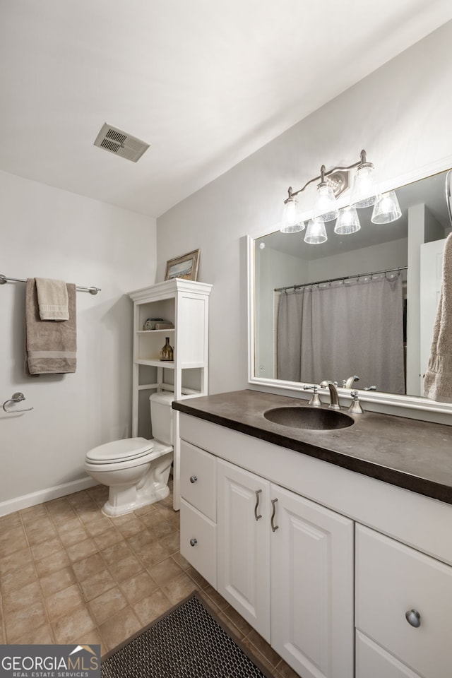 3772 Paces Ferry W SE, Atlanta, GA 30339 - bathroom with toilet, vanity, tile patterned floors, and baseboards