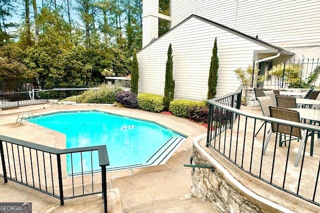3772 Paces Ferry W SE, Atlanta, GA 30339 - community pool featuring a patio and outdoor dining area