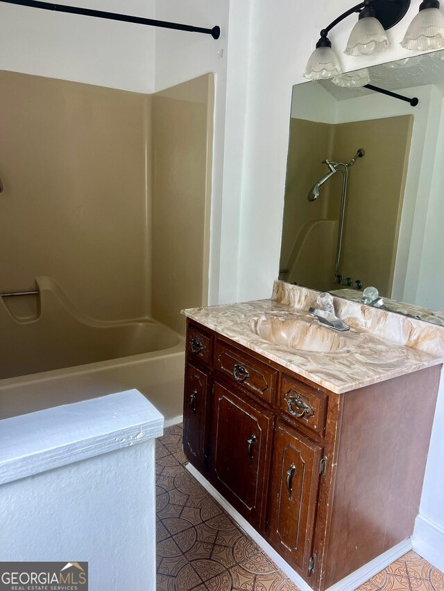 bathroom featuring tile patterned floors and vanity