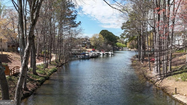 property view of water featuring a boat dock
