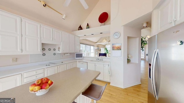 kitchen with white cabinetry, white appliances, and light wood-style floors