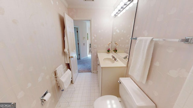 half bathroom featuring tile patterned flooring, ornamental molding, toilet, vanity, and visible vents