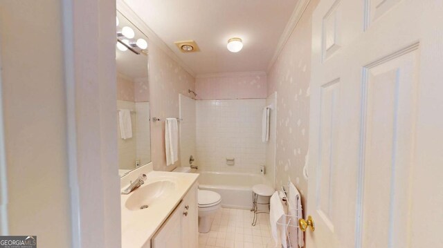 full bath with bathing tub / shower combination, toilet, crown molding, and vanity