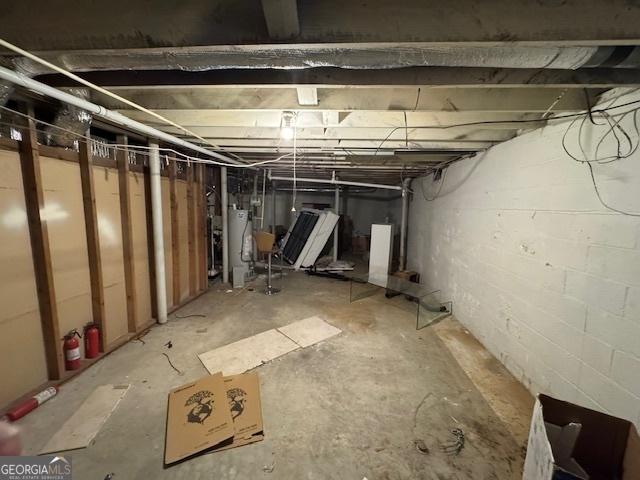 unfinished basement with water heater