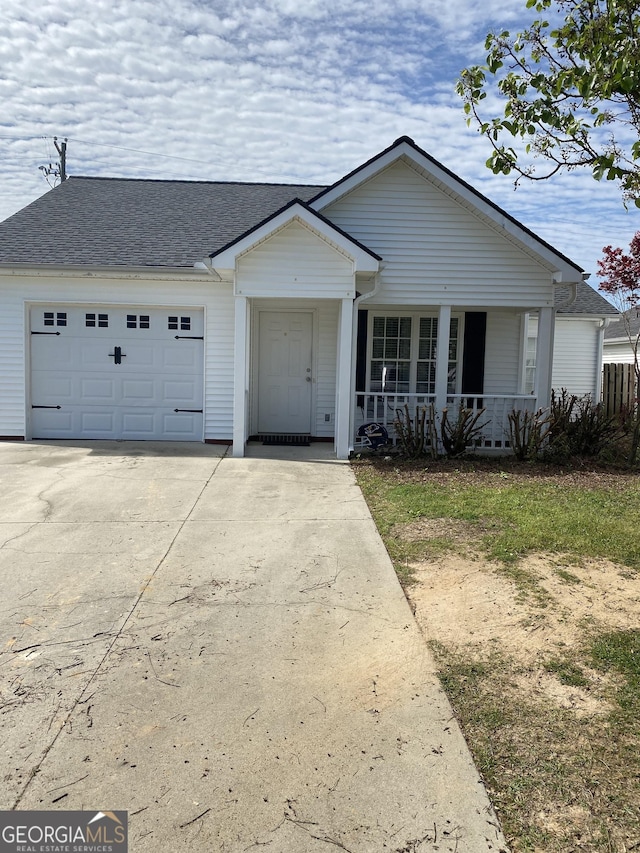4 Baldwin Pl SE, Moultrie, GA 31788 - view of front of property featuring concrete driveway, an attached garage, a porch, and a shingled roof