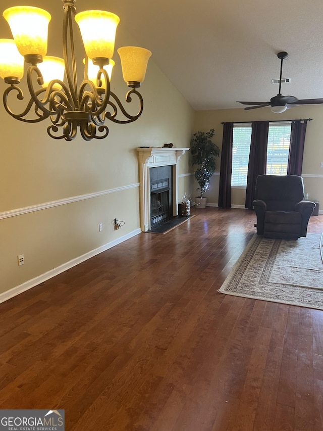 4 Baldwin Pl SE, Moultrie, GA 31788 - living room with a chandelier, wood-type flooring, lofted ceiling, a tiled fireplace, and a ceiling fan