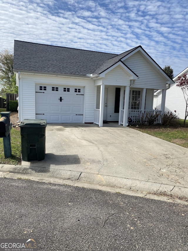 4 Baldwin Pl SE, Moultrie, GA 31788 - view of front of house with covered porch, a garage, driveway, and a shingled roof