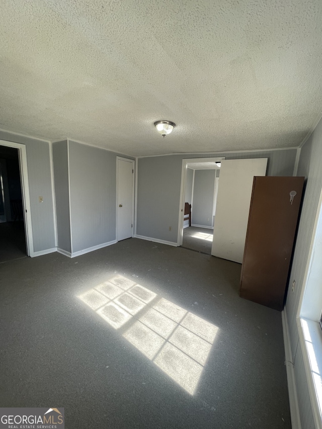 1911 Park Ave S, Tifton, GA 31794 - unfurnished room with a textured ceiling and carpet flooring