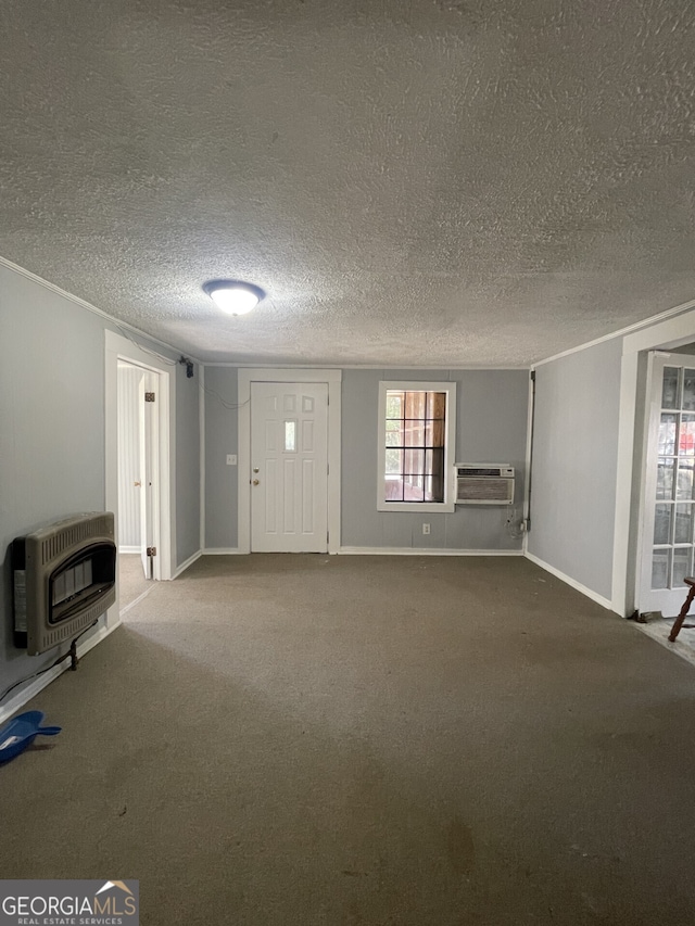 1911 Park Ave S, Tifton, GA 31794 - unfurnished living room with heating unit, a textured ceiling, carpet floors, a wood stove, and a wall unit AC