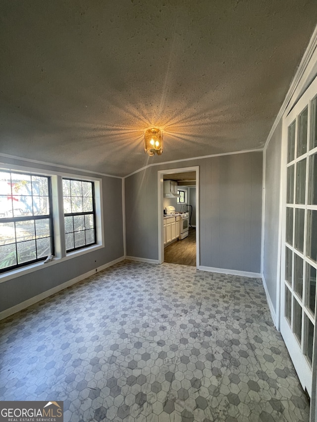 1911 Park Ave S, Tifton, GA 31794 - unfurnished room featuring baseboards, a textured ceiling, and crown molding