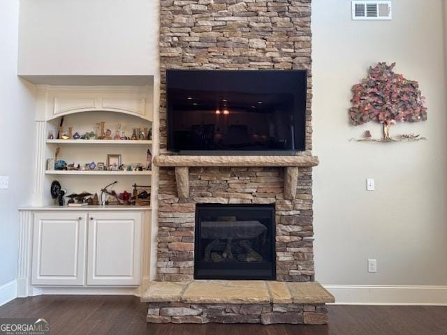 5530 Lacebark Pine Ct, Cumming, GA 30040 - living area featuring a fireplace and wood finished floors