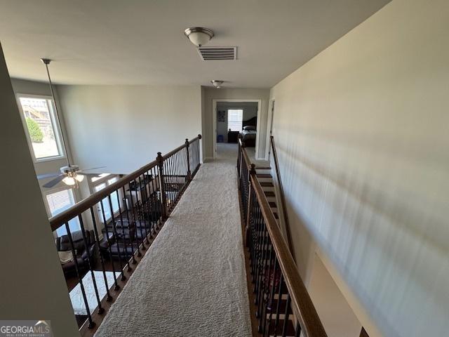 5530 Lacebark Pine Ct, Cumming, GA 30040 - hallway with an upstairs landing and carpet flooring