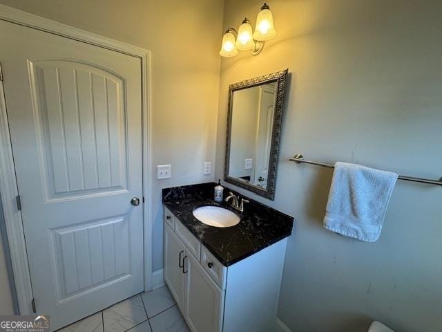 5530 Lacebark Pine Ct, Cumming, GA 30040 - bathroom with vanity and marble look tile flooring