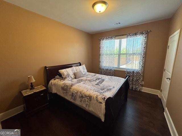5530 Lacebark Pine Ct, Cumming, GA 30040 - bedroom with dark wood-style flooring and baseboards
