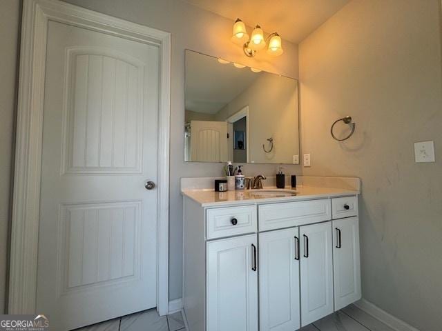 5530 Lacebark Pine Ct, Cumming, GA 30040 - bathroom featuring vanity and baseboards