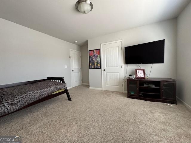 5530 Lacebark Pine Ct, Cumming, GA 30040 - carpeted bedroom featuring baseboards