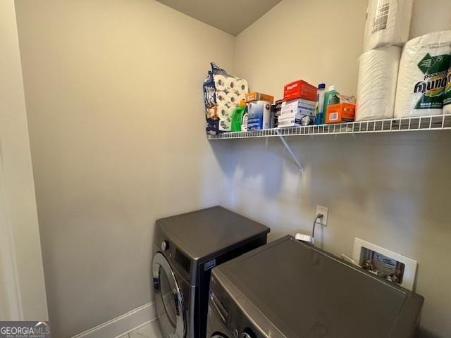 5530 Lacebark Pine Ct, Cumming, GA 30040 - laundry area with separate washer and dryer and baseboards
